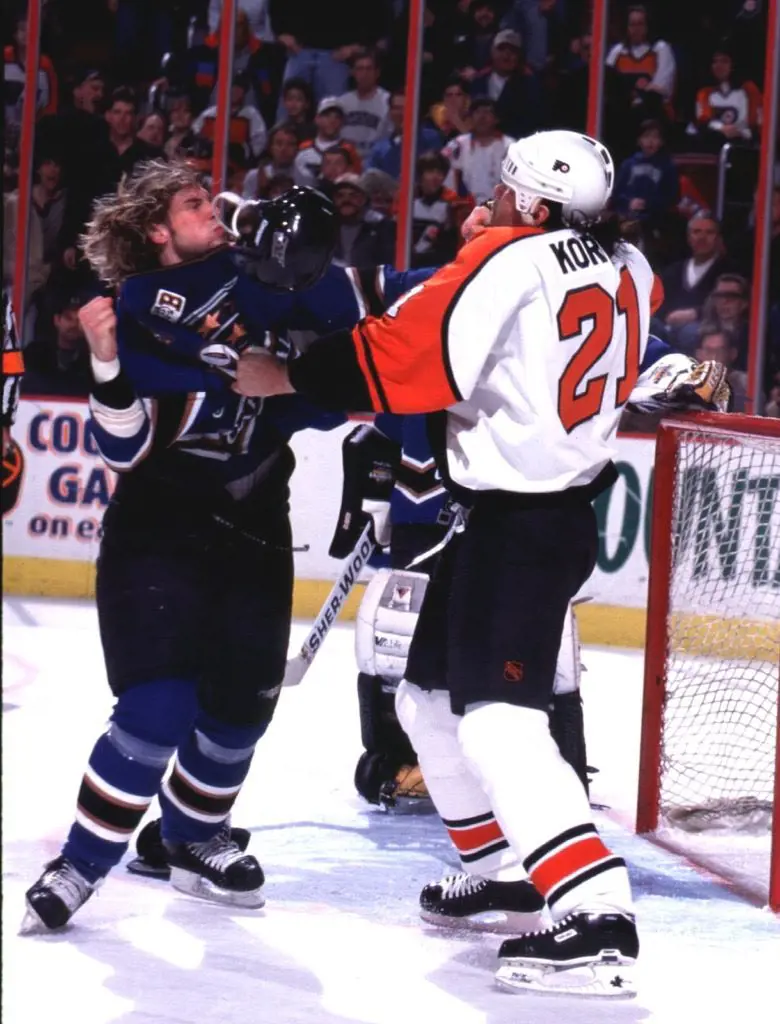 Brendan Witt and Dan Kordic fighting in the rink on Mar 9, 1997 