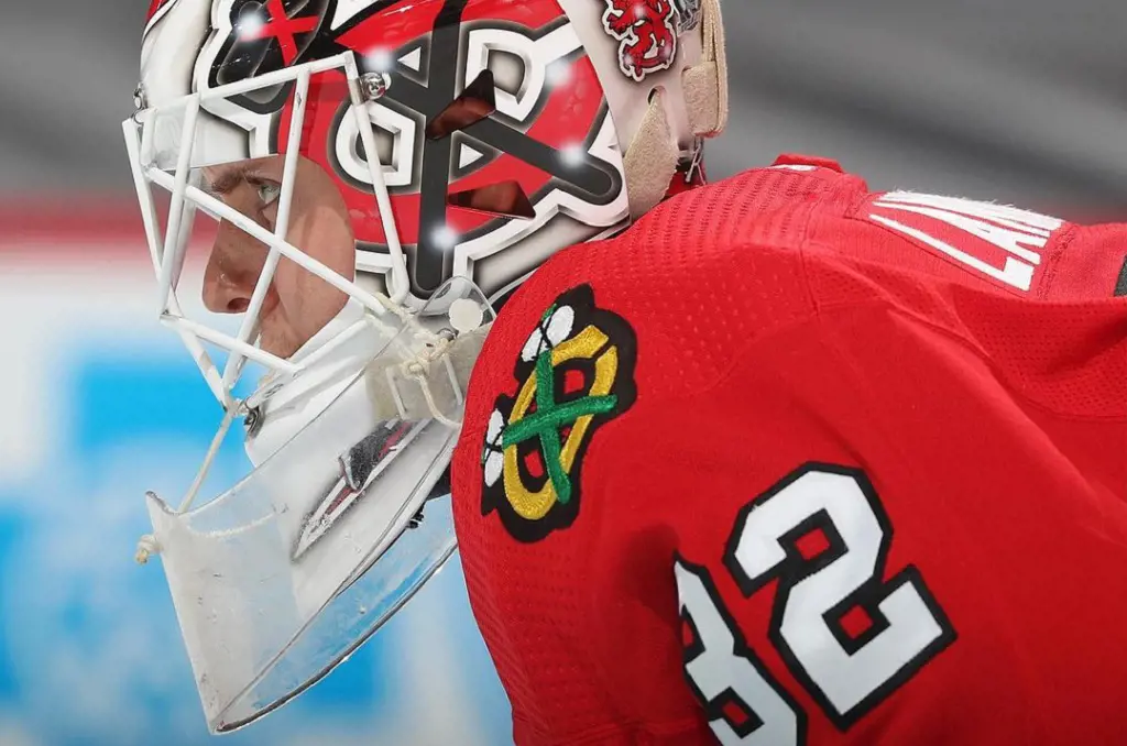 Lankinen wearing a Lexon Throat protector, attatched to the Goalie's helmet.