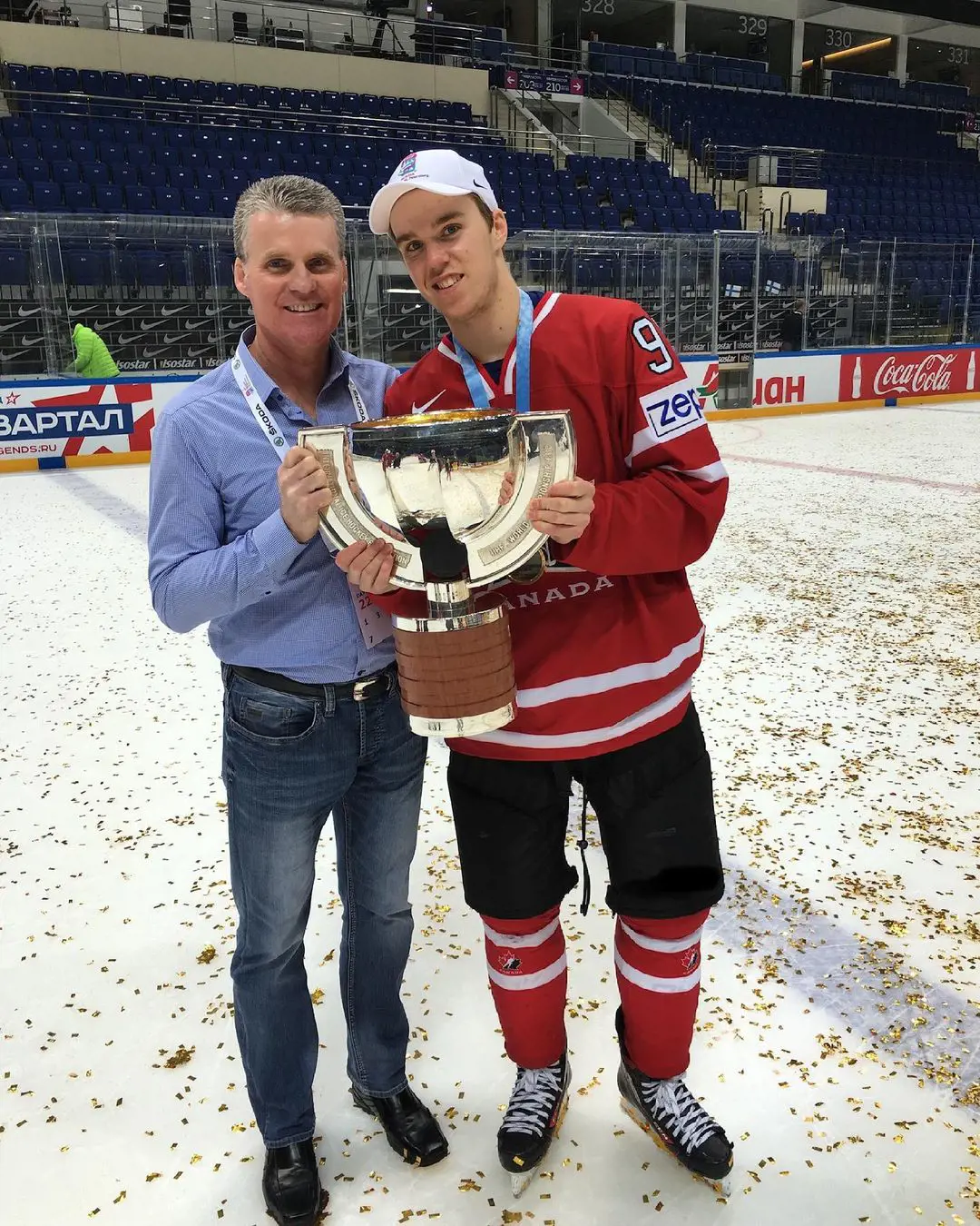 Connor uploaded a picture holding 2016 World Championship Trophy with his father